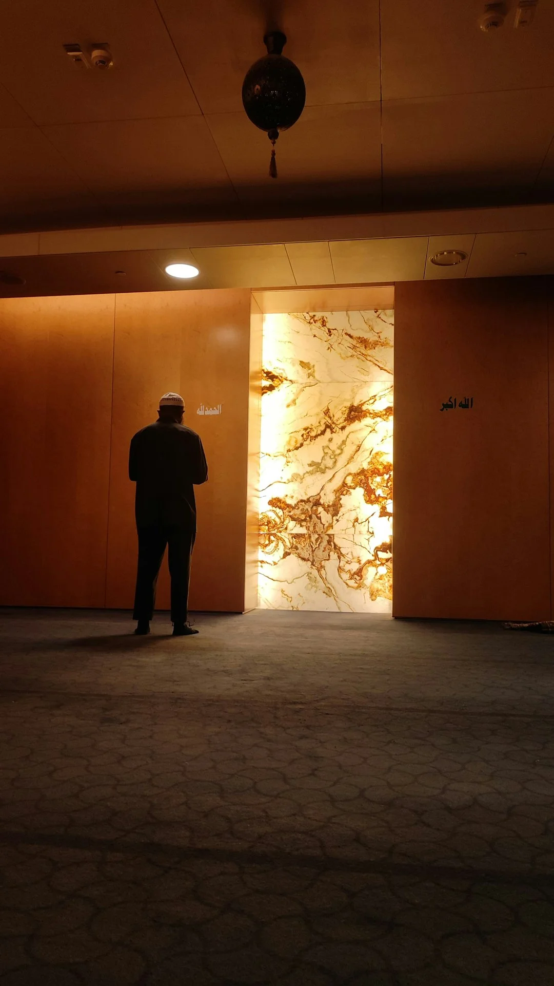 A man in a suit standing in a room